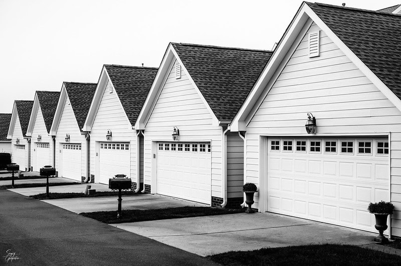 A series of houses with garage doors